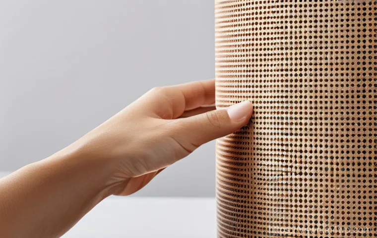 촉각적 UX 디자인의 신뢰성과 브랜드 이미지 - **Prompt:** "A close-up shot of a person's hands gently typing on a sleek, minimalist high-end smart...